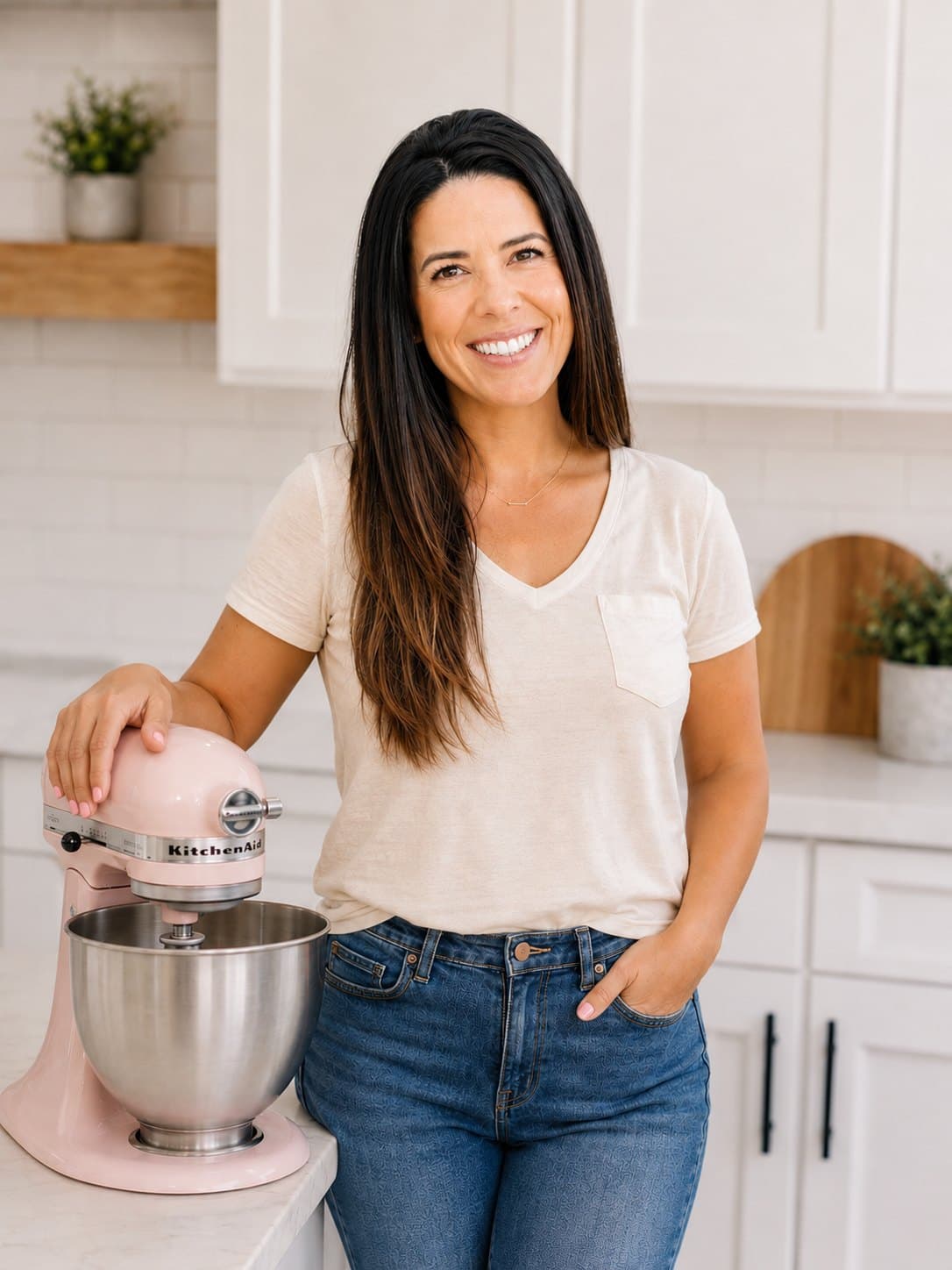 Melissa in her kitchen with her pink stand mixer